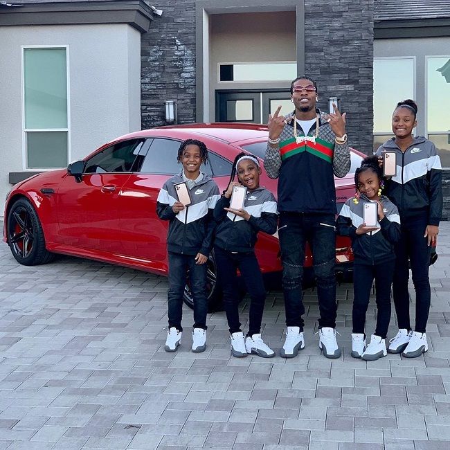 Caption: CJ along with his four children. 