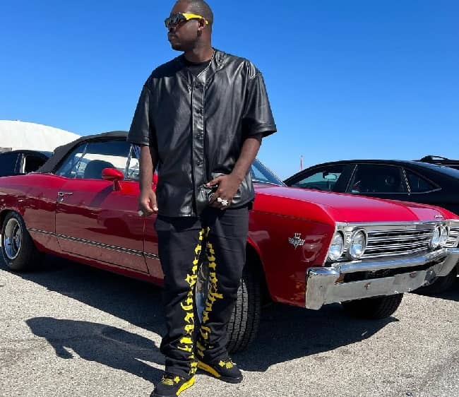 Theotis Beasley posing with his car (Source Instagram)
