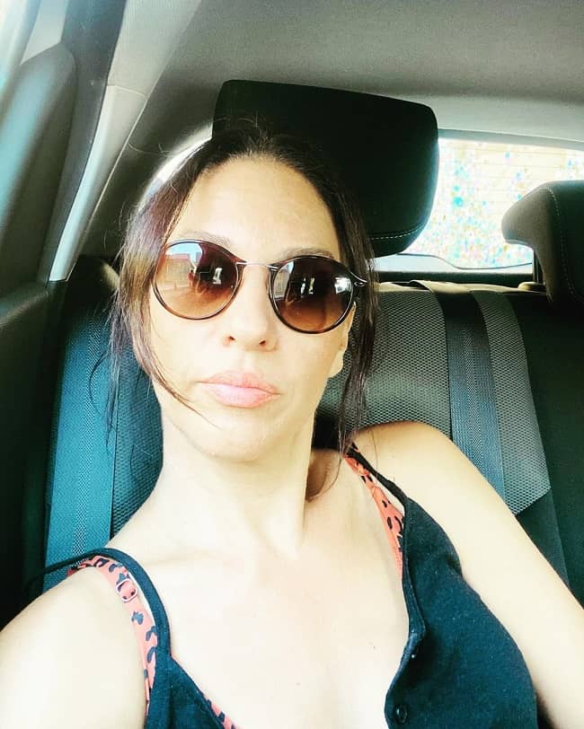Evrim Alasya posing in her car (Source Instagram)
