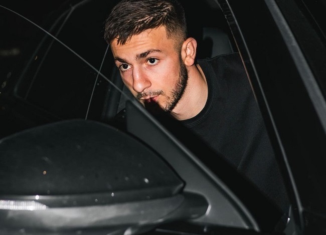 Halil Dervisoglu posing with his car(Source Instagram)