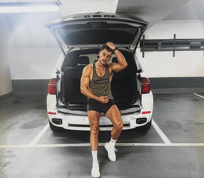 Matt Lapinskas posing with his car (Source Instagram)