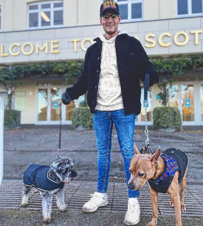 Matt Lapinskas posing with his dog (Source Instagram)