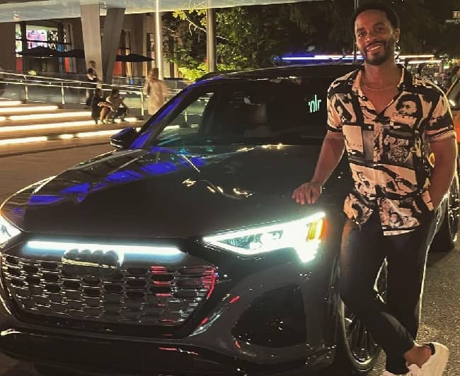 Andre Holland posing with his car (Source Instagram)