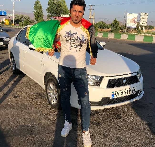 Amredin Sharifi with his car (Source Instagram)