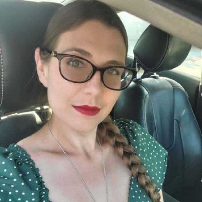 Laura Post in her car (Source X.com)